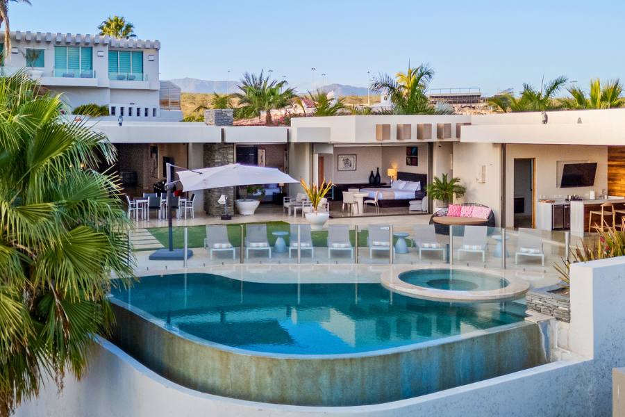 Exterior of a villa in Cabo with a large pool and deck